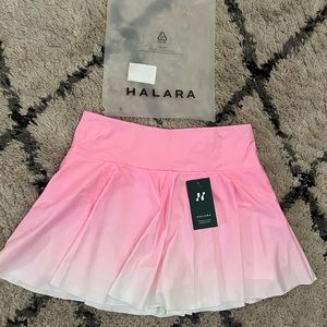 Tennis skirt with attached bike shorts. NEVER WORN! super cute! Stretchy!